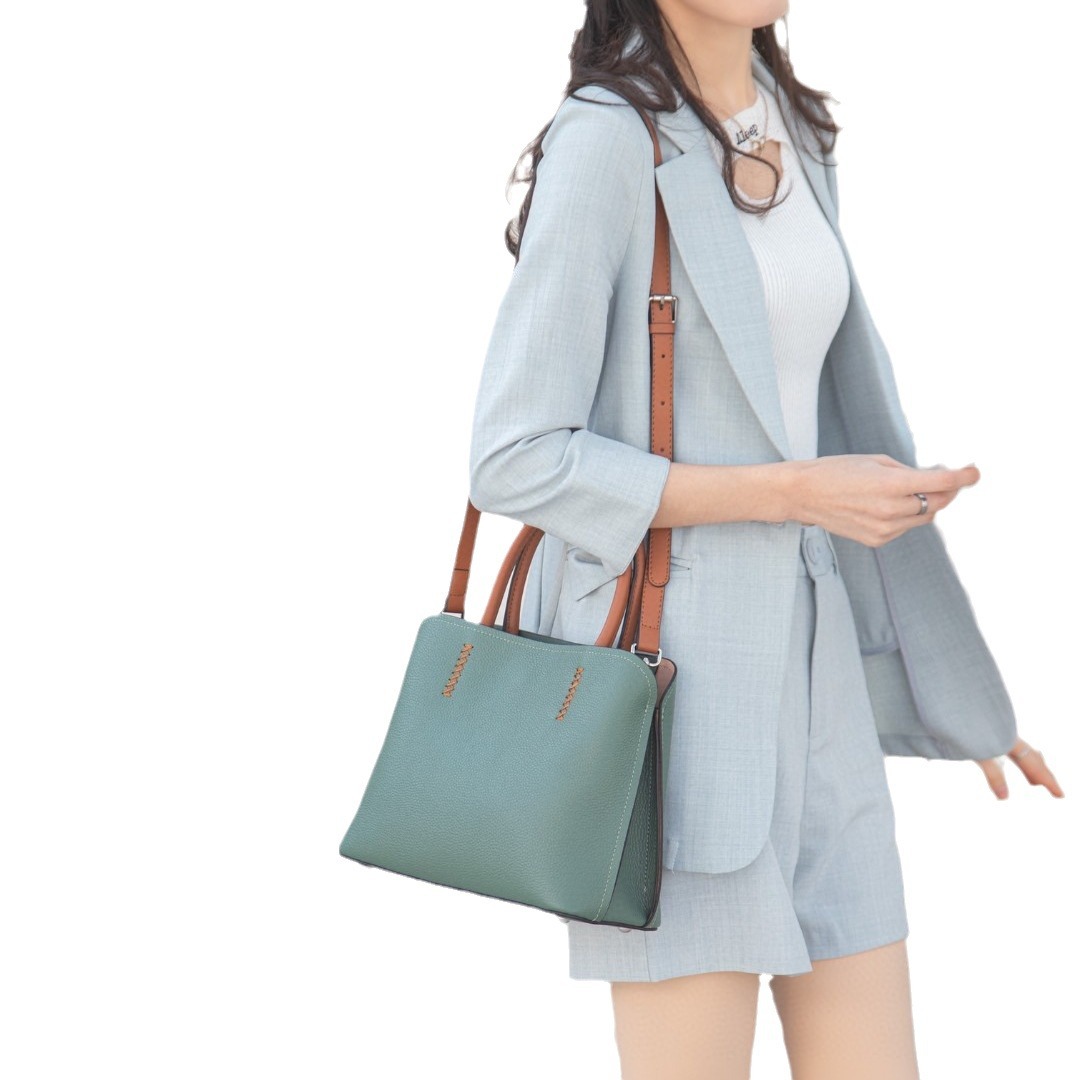 本革高級ボーリングバッグシリーズの中号の小さいサイズの大衆が牛革のボストンバッグをデザインしています。