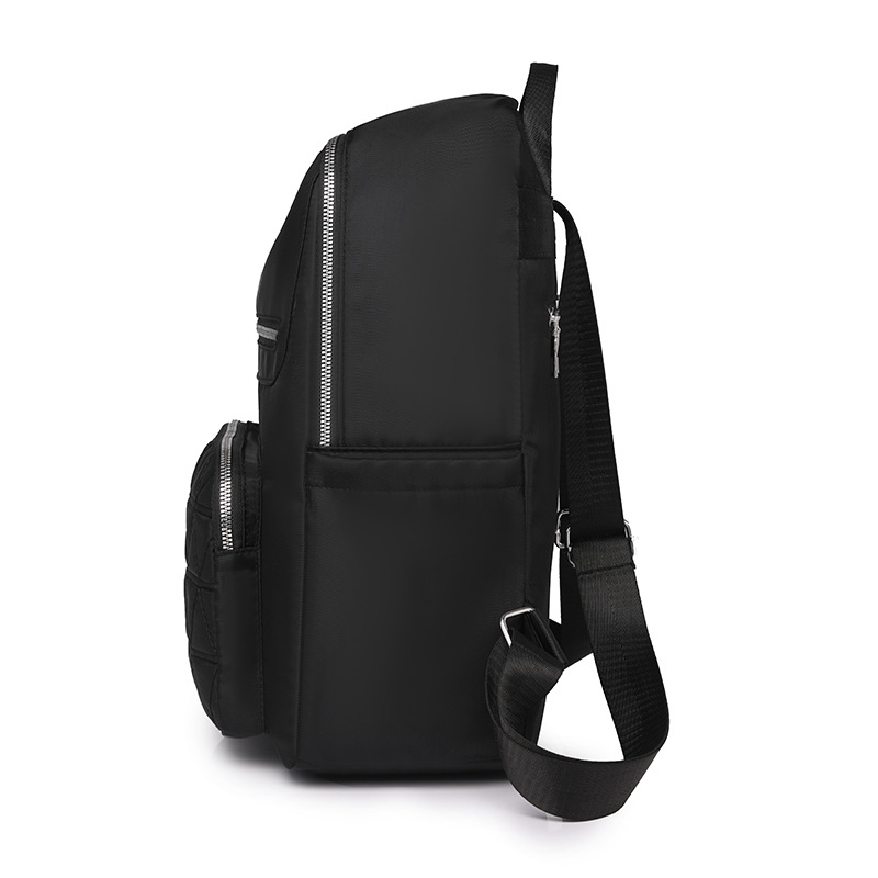 Mochila de mujer salvaje 2024 nueva mochila de viaje resistente al desgaste impermeable de gran capacidad bolsa de nailon al por mayor