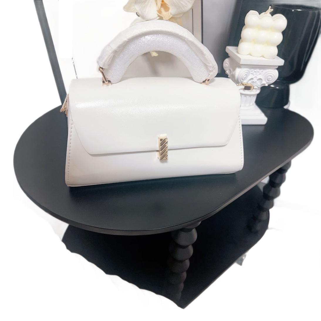 Bolso de mujer Carmel 2025 bolso de mano diagonal primavera - verano moda de cadena, barra de oro diagonal, nueva Alta Gama