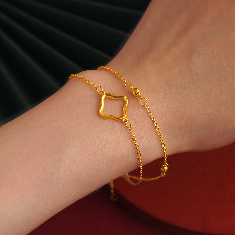 Aleación de cobre de Cercanías de moda todo partido pulsera de doble capa trébol de cuatro hojas pulsera de doble línea joyería de suministro directo de fábrica de las mujeres