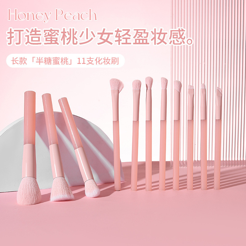 新しい11本の長い柄の蜜桃の粉の頬紅は顔の化粧の道具のアイシャドーのブラシを塗って傷のファンデーションの化粧のブラシのセットを覆います。|undefined