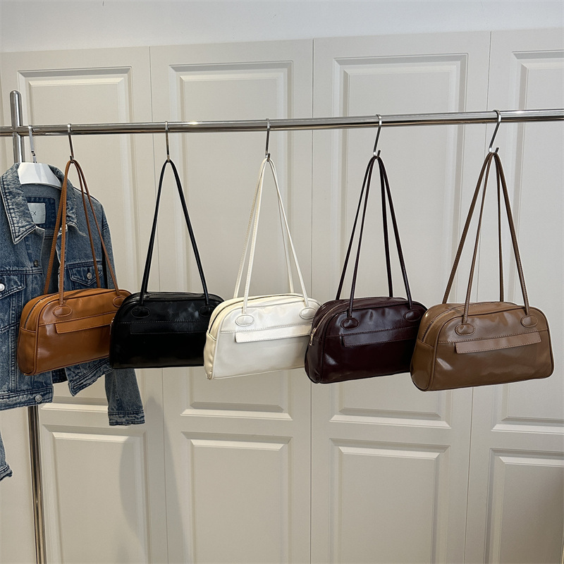 Bolso de bolos portátil con cremallera de múltiples bolsillos de gran capacidad de diseño de nicho para mujer 2025 nuevo bolso de hombro de cercanías para axila