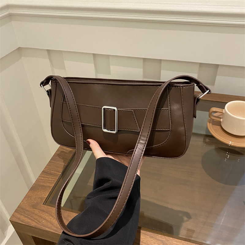 Bolsos de brazo de estilo extranjero para mujeres 2025, nueva moda de primavera, hebilla de cinturón de diseño de nicho, bolso de mochila