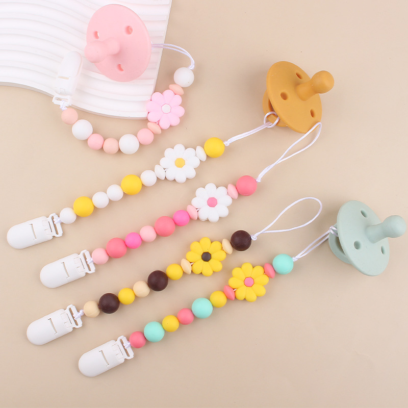 Productos para bebés Clip de chupete de plástico de bricolaje para bebés Creativo para bebés Little Daisy Silicona Mouth Pezones anti-caída de la cadena