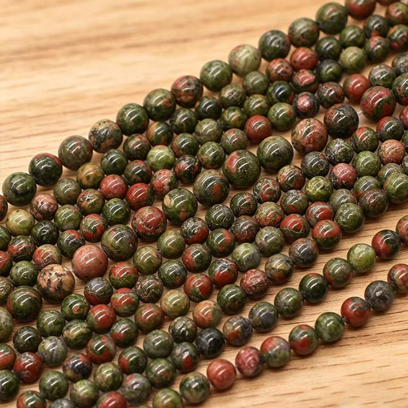 Los fabricantes suministran directamente collares de pulsera de cuentas dispersas de cuentas redondas de esmeralda natural DIY joyas semiacabadas al por mayor