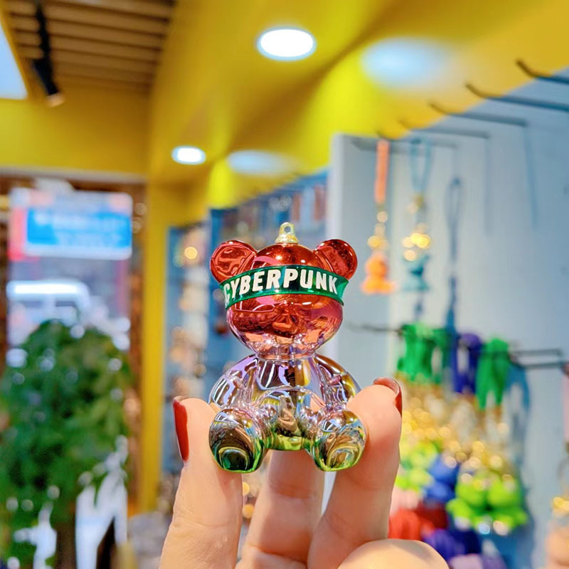 Resina de dibujos animados colorido gradiente oso llavero creativo postura sentada red oso llavero de moda colgante de llave de automóvil