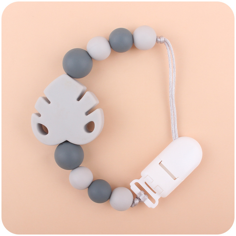 Suministros para bebés chupete cadena creativa bebé dibujos animados hojas silicona mordedura cadena anti-gota molar Nuevo