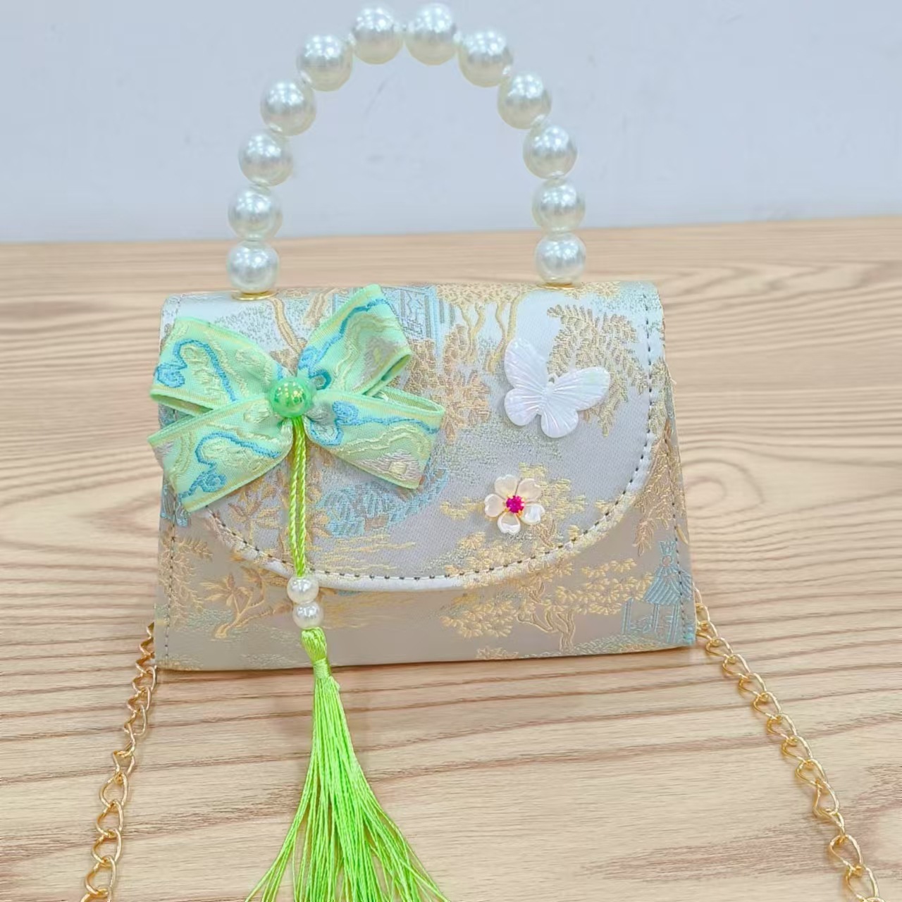 202 nuevo arco de estilo nacional bolsos para niños pequeños bolsos de moda de perlas de moda princesa bolsos de mano inclinados