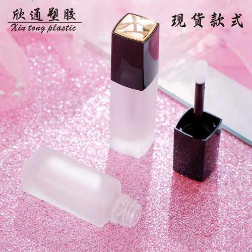 Wholesale empty lip glaze tube, empty glass tube with spray gold top and black cover, lip gloss bottle lip glaze tube