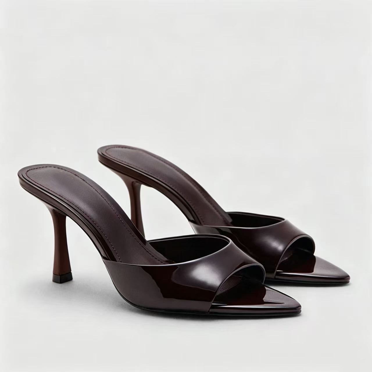summer sandals made of patent leather stiletto heels
