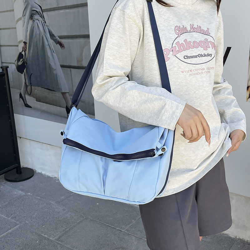 Bolso de lona de moda coreana 2025 verano nuevo bolso femenino estilo universitario bolso de hombro casual bolso de mensajero de gran capacidad marea