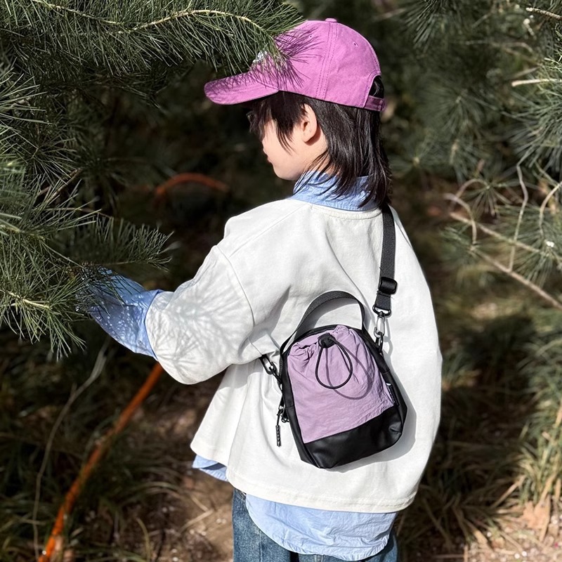 Mochila de mochila para niños cool, personalidad de empalme de colores contrastantes, bolsas de tazas de agua para niños, bolsas de hombro casuales simples coreanas para mujeres