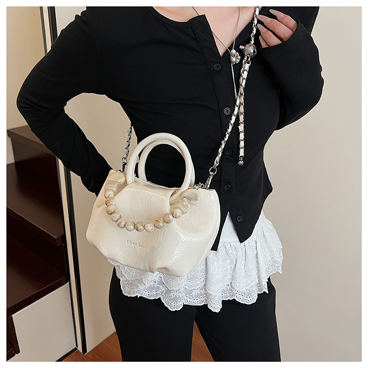 A stylish and trendy beaded bag for women, a new summer chain crossbody cloud bag for women in 2025 undefined
