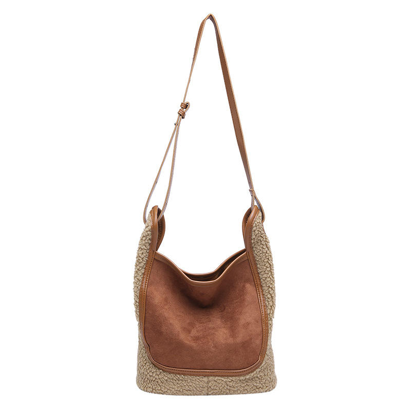 Retro tela esmerizada bolso de cubo de agua mujer 2025 nuevo nicho de moda cordero gran capacidad mochila de hombro