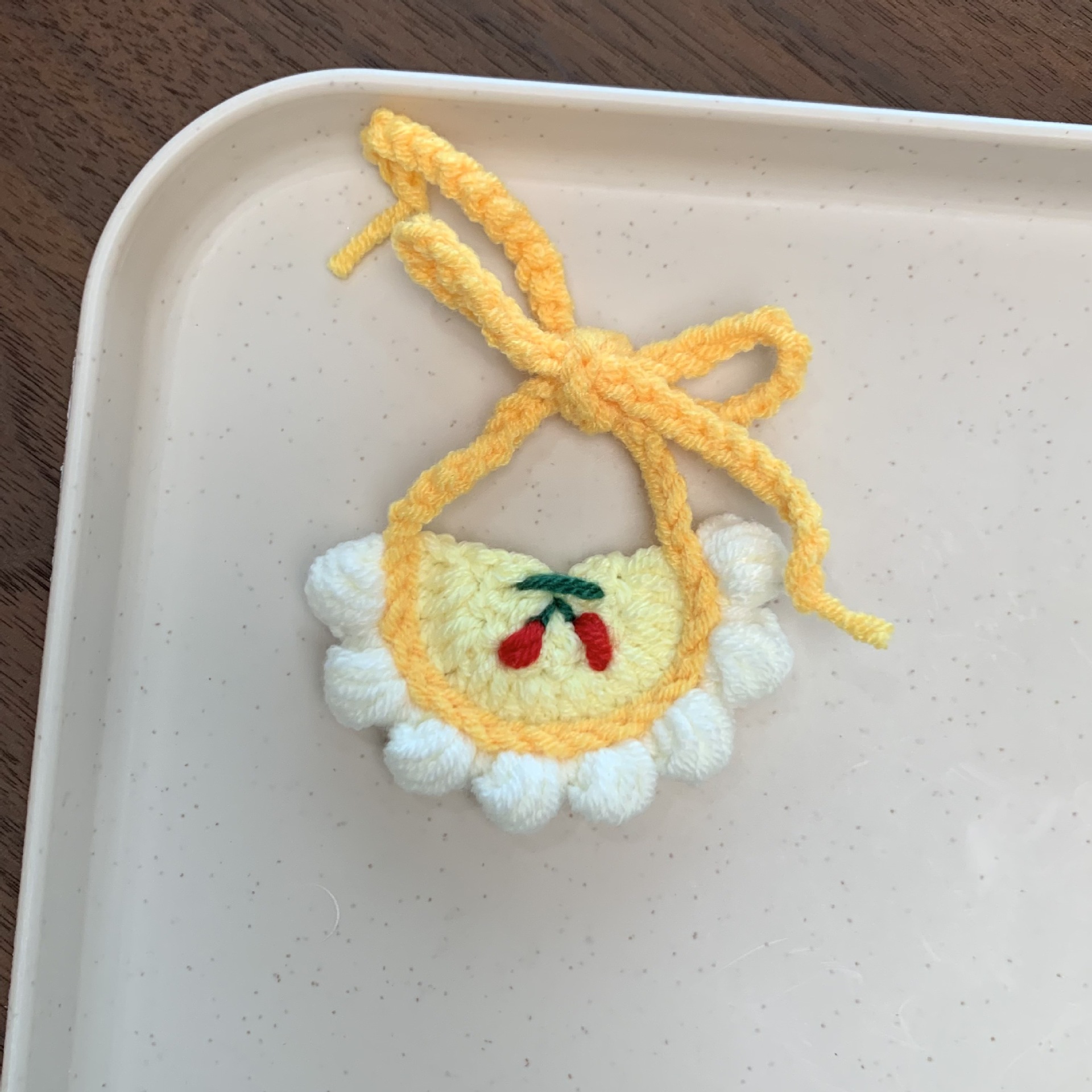 Cherry bib with white edge and yellow bottom