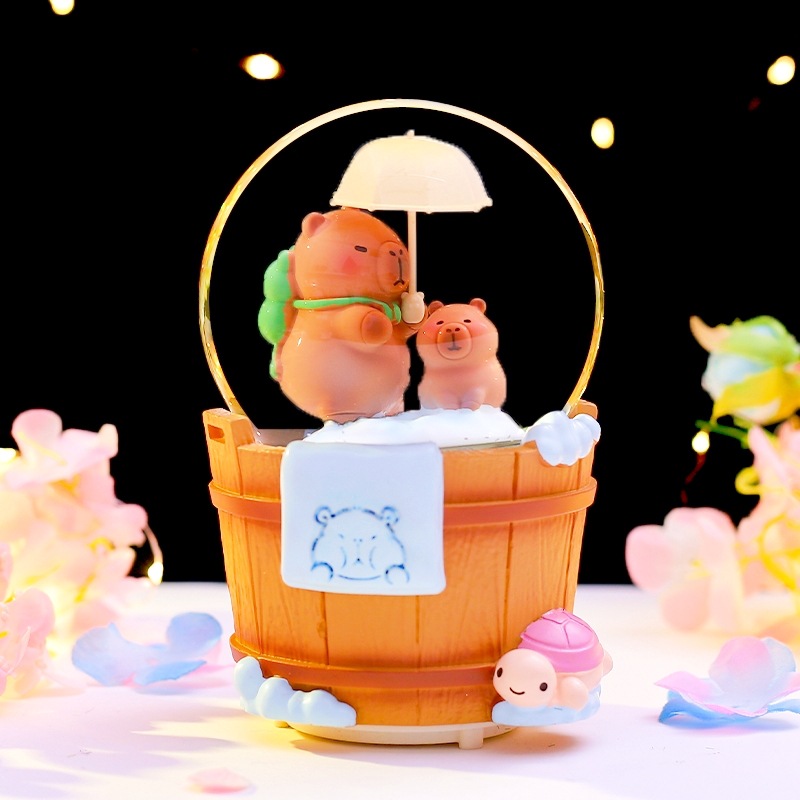 Caja de música de bola de cristal de Kapibala ingenua y linda, adornos de escritorio luminosos, nieve que cae, regalo de cumpleaños para estudiantes y niños