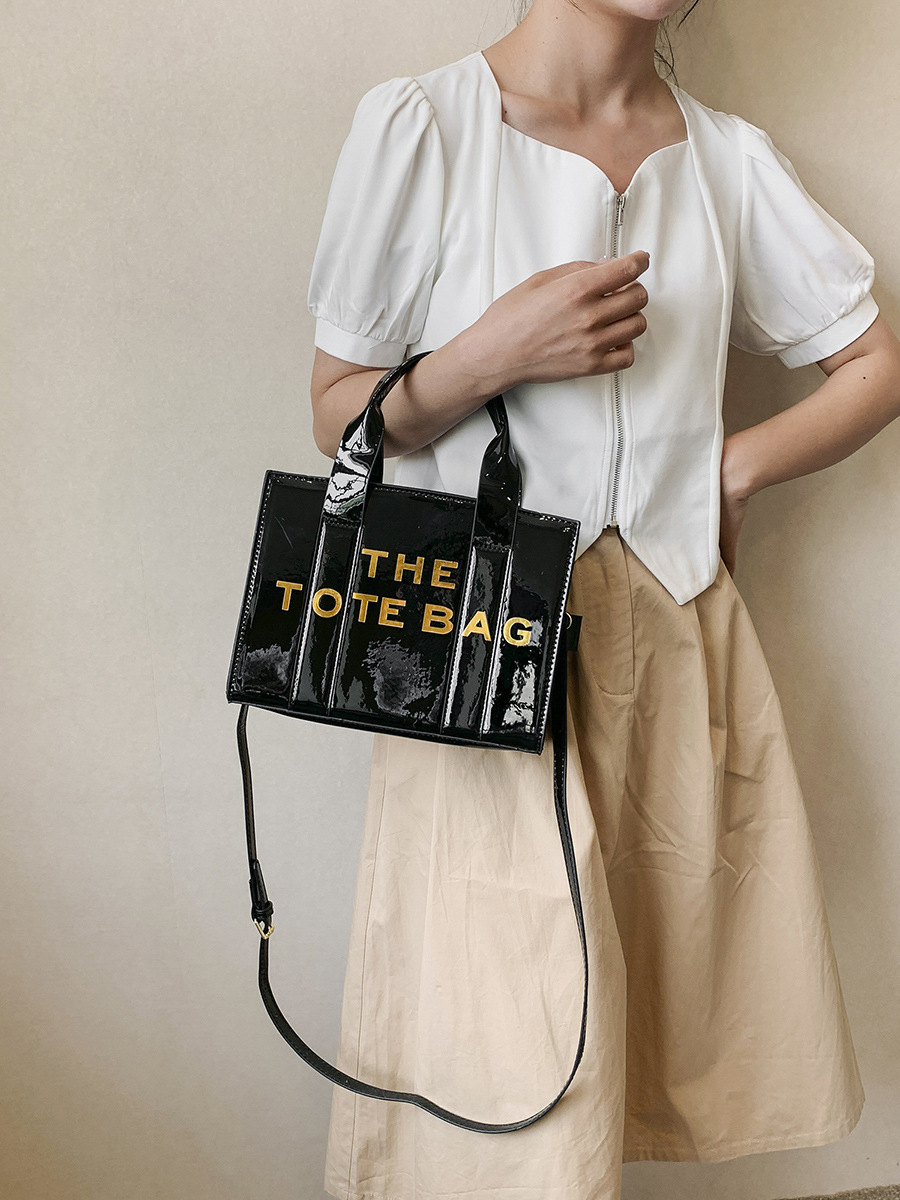 Bolso de mano estilo nuevo transfronterizo para mujer 2025, bolso de hombro y bandolera de moda europea y americana de cuero charol con letras en relieve