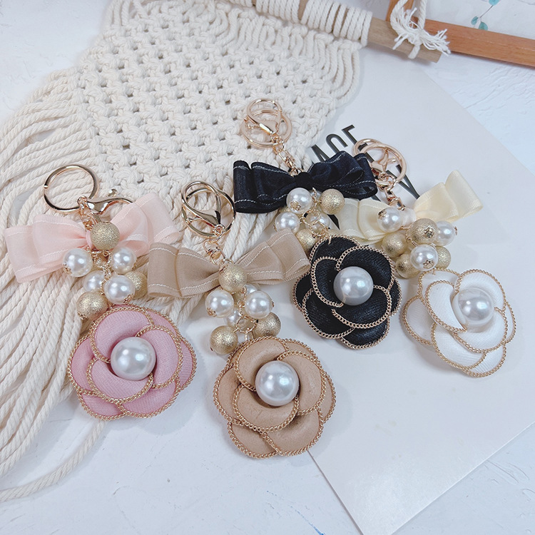Cadena de La Perla La Camelia llavero bolsa colgante moda doble arco creativo mercancías del comercio exterior image 6