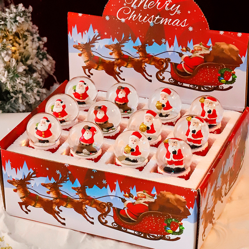 Una variedad de regalos de decoración de Navidad Navidad iluminante bola de cristal caja de música ventana diseño de velas lámparas de viento árbol de Navidad