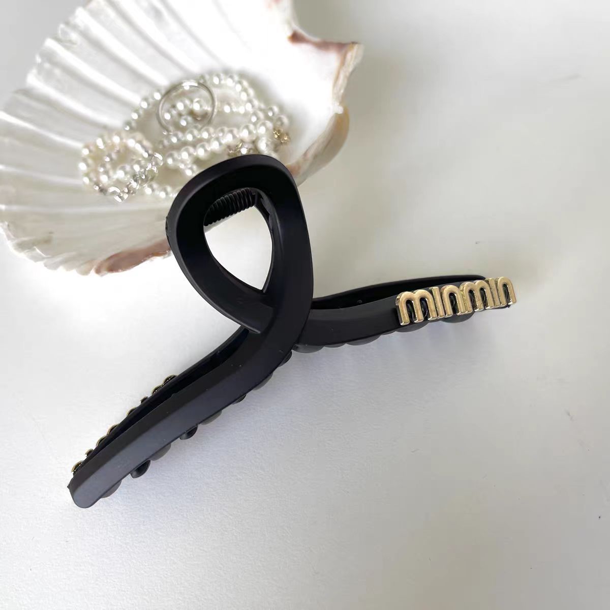 Black crab pin with letters