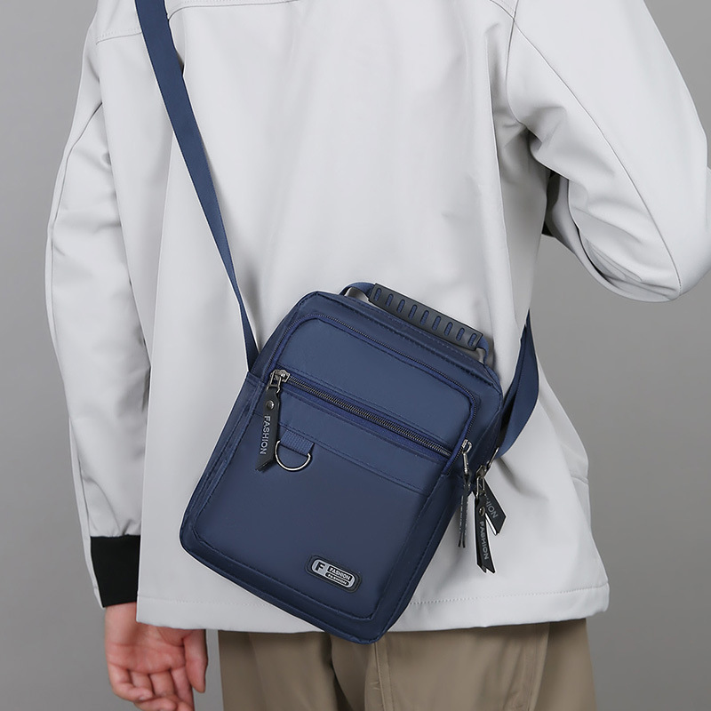2025 nuevo bolso de moda para hombres simple ocio bolso de hombro de negocios de nylon de viaje versátil bolso de mano vertical