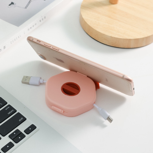A variety of data cable storage boxes, mobile phone charging cable winders with mobile phone holders, portable headphone storage boxes