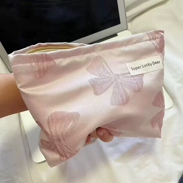 Fuchsia cosmetic bag with bow