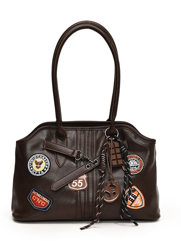 Insignia retro de gran capacidad hombro brazo bolso para mujeres 2025 nueva moda transfronteriza alta textura bolso