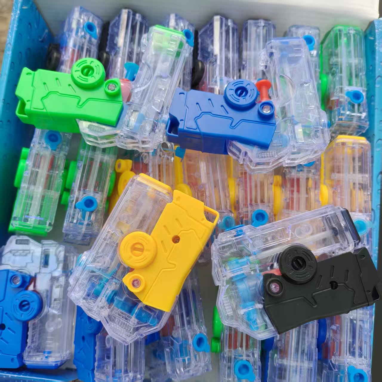 Mini jardín de infantes pistolas de agua para niños verano transparente jugando en la playa de agua juguetes de agua tienda de regalos de venta caliente