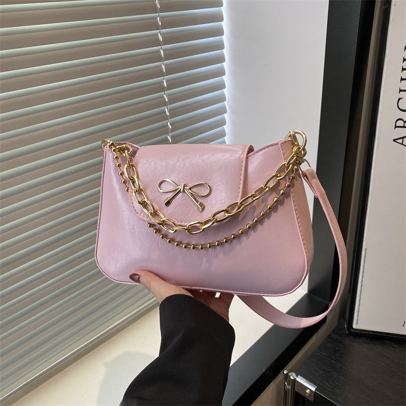 2025 nuevo estilo de color sólido tendencia primavera casual bowknot cadena de mujer axila de un solo hombro bandolera mujer