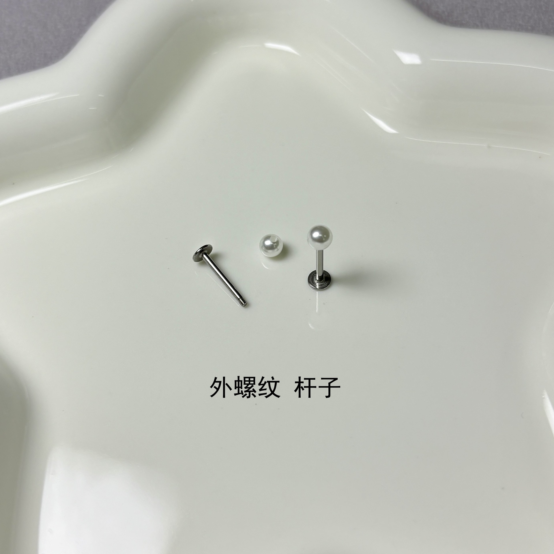 Silver pointed spike labret stud material detail