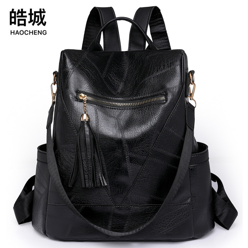 Comercio exterior al por mayor 2023 nuevo estilo retro damas mochila antirrobo moda borla mochila de viaje al aire libre de gran capacidad