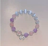 Purple bracelet with bow, cat's eye