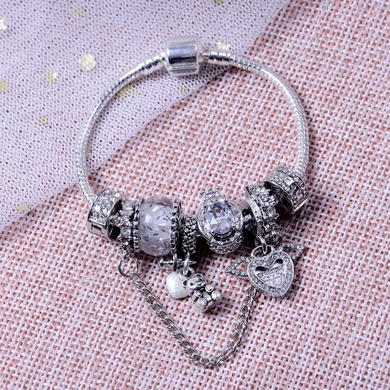 Bracciale donna perle occhio di gatto ali angelo e orsetto_voghion.com