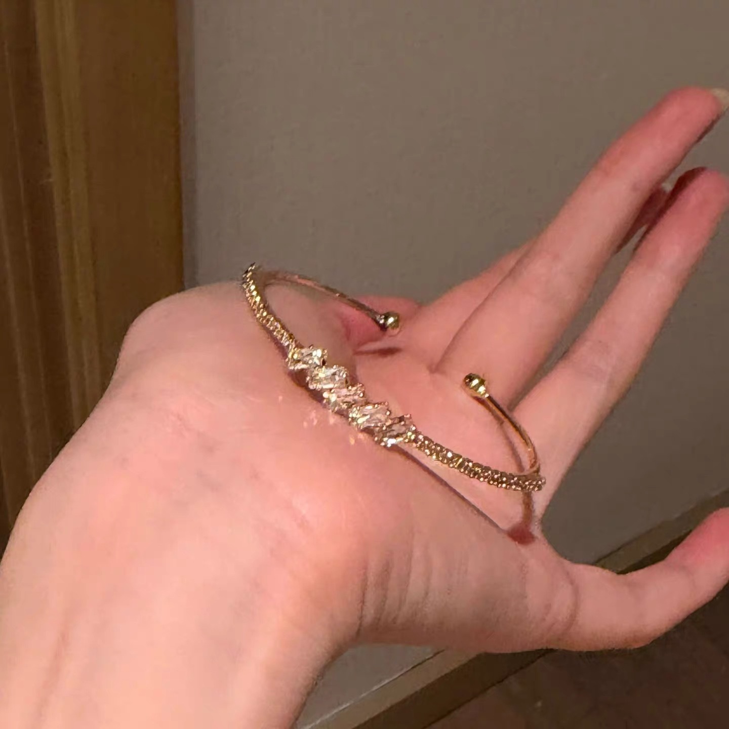 Golden bracelet with zircon