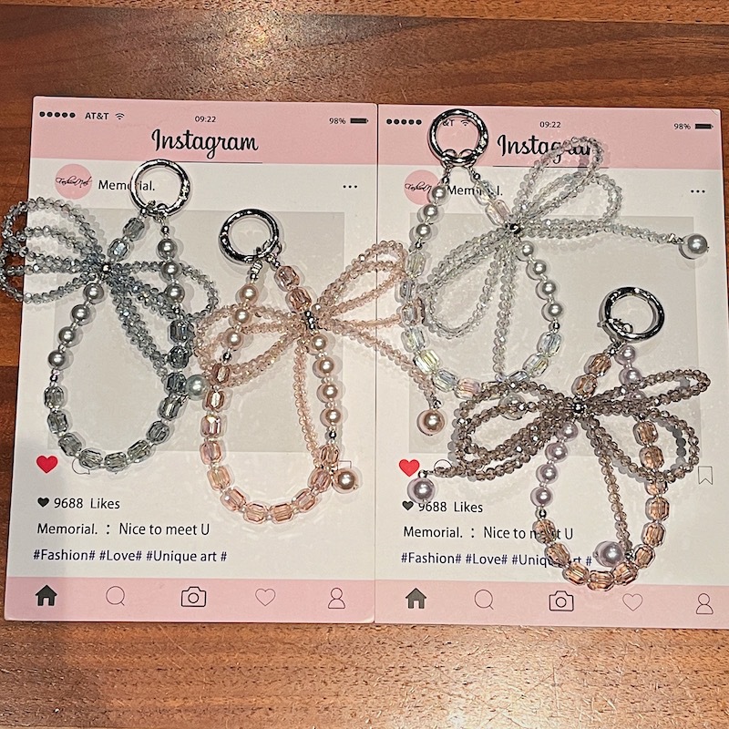 Boutique hecho a mano de alta gama para teléfono móvil cadena corta ins perla mariposa cordón de teléfono móvil de moda colgante de mensajero corto