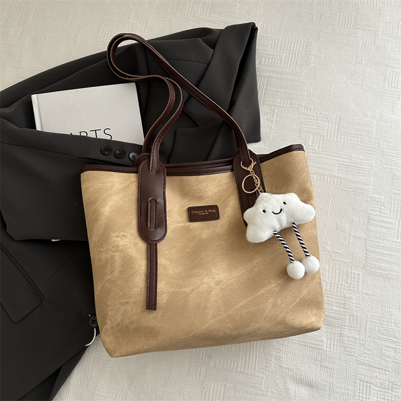 Bolso retro de gran capacidad para mujeres 2024 nueva moda textura bolso de hombro simple empalme bolso de viaje