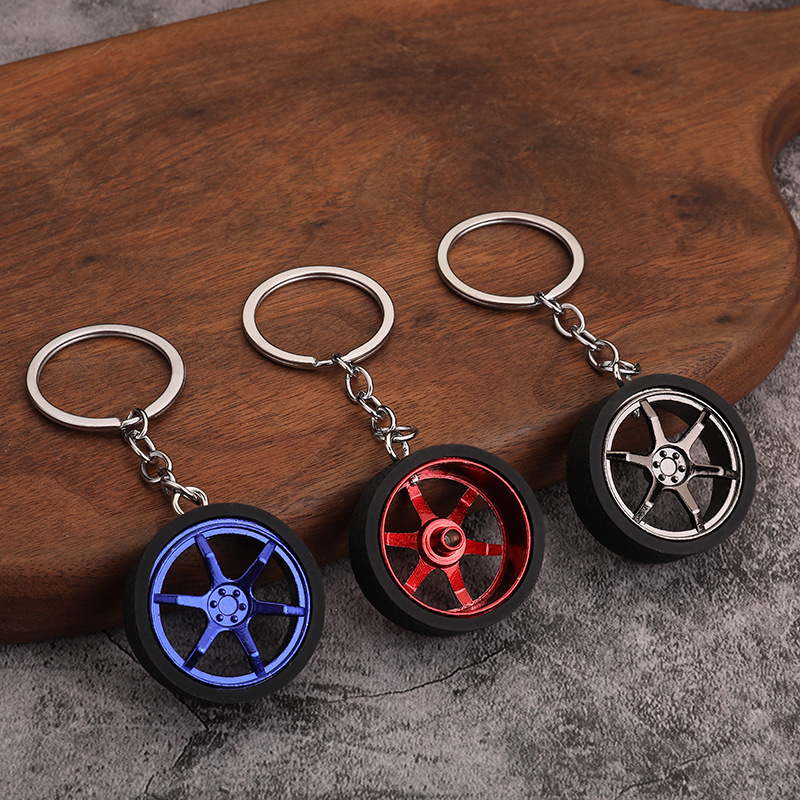 Creative mini car wheel hub keychain PVC soft rubber tire car key chain accessories turbine piston pendant