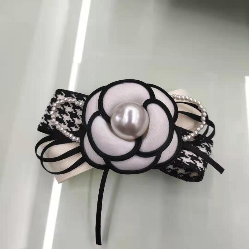 韓国の小香風ツバキの花の千鳥の格の蝶結びのスプリングは後頭部の頭を挟みます。|undefined