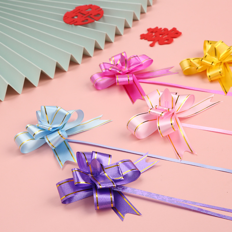 Borde dorado mano tire flor arco cinta regalo embalaje tire flor suministros de la sala de bodas boda decoración del coche de la boda tire Flor al por mayor