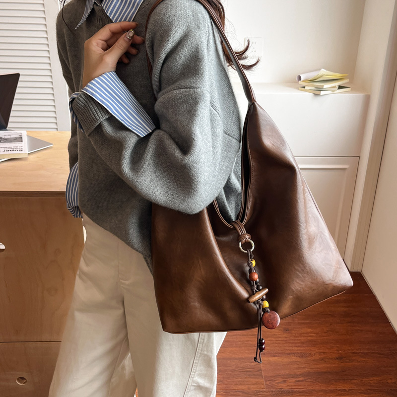 2025 invierno nuevo estilo de alta calidad bolsas de brazo coreanas de moda de gran capacidad bolsas de mano bolsas de hombro retro de viaje de mujer