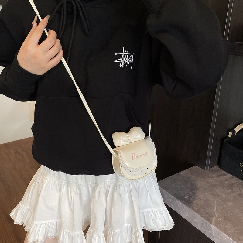 Nuevos accesorios para niños dulces lindos bolsos de hombro princesa arco ondulado punto de micro bolso de bebé