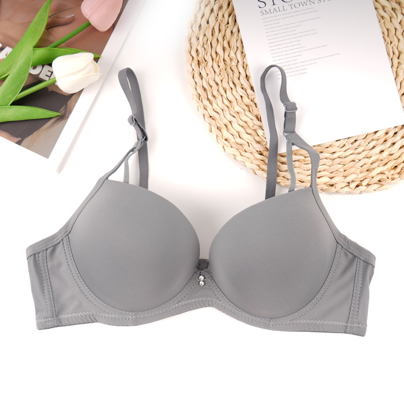 Fábrica de stock de ropa interior lisa sin marcas de pecho pequeño damas juntas sujetador de ajuste de soporte de la niñez sujetador del sudeste asiático