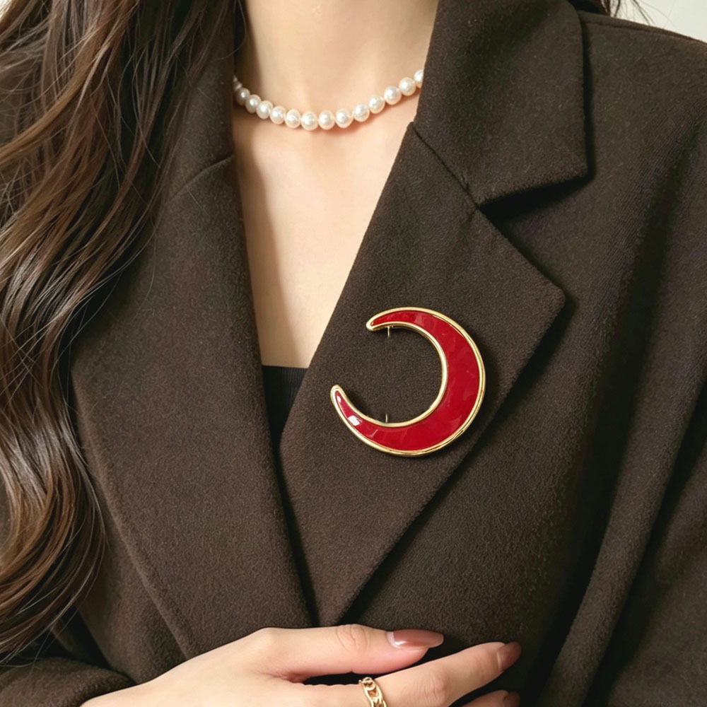 French vintage crescent moon brooch, red and white enamel with metal edges, niche accessory for suit jackets