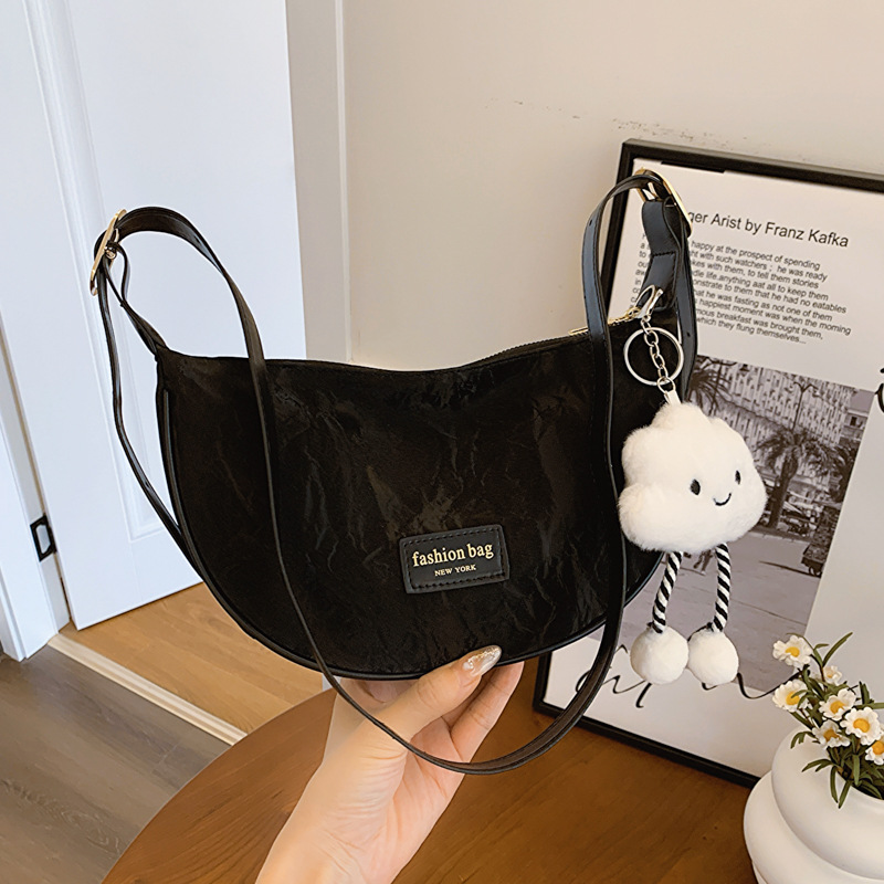 Bolso de diseño nuevo para mujer 2025, textura de alta calidad, estilo único, versátil para el verano, bolso de hombro cruzado con diseño llamativo, bolso de moda estilo dumpling.