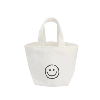 Korean Version 2025 New Smiling Face Ins Style Super Hot Canvas Bag for Girls Students Bento Mini Handbag Wholesale