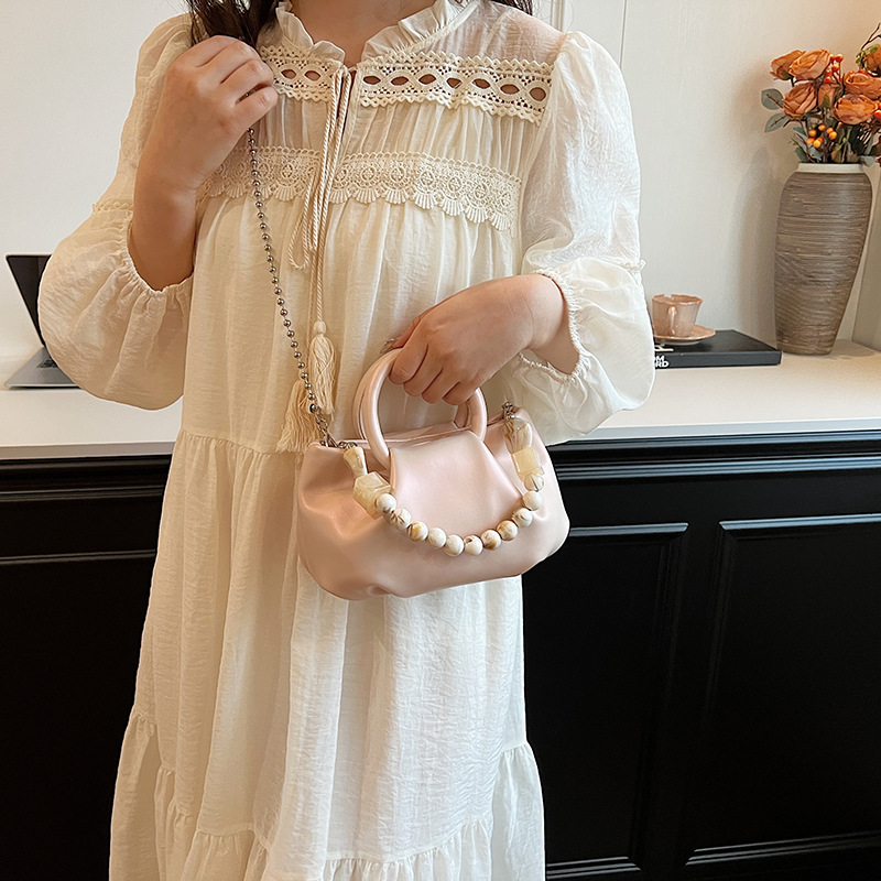 High end handbag for women in 2024, new niche design, summer handheld pleated chain strap, crossbody cloud bag_voghion.com