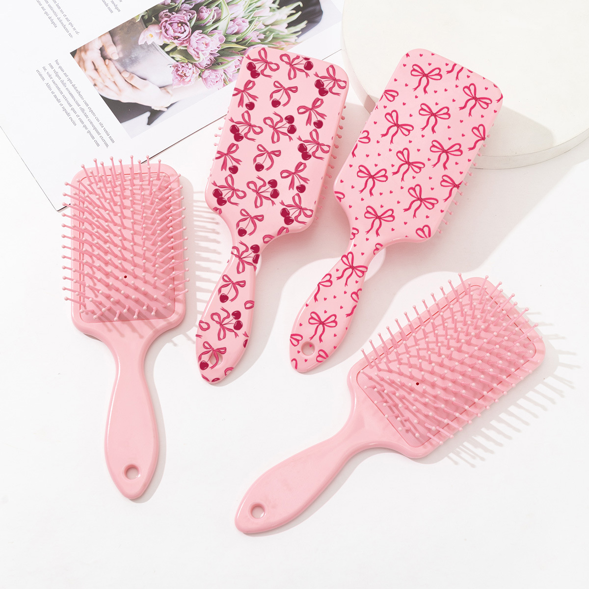 Estilo explosivo transfronterizo peine de colchón de aire con estampado de cereza con lazo lindo rosa peine de peluquería anti-nudo