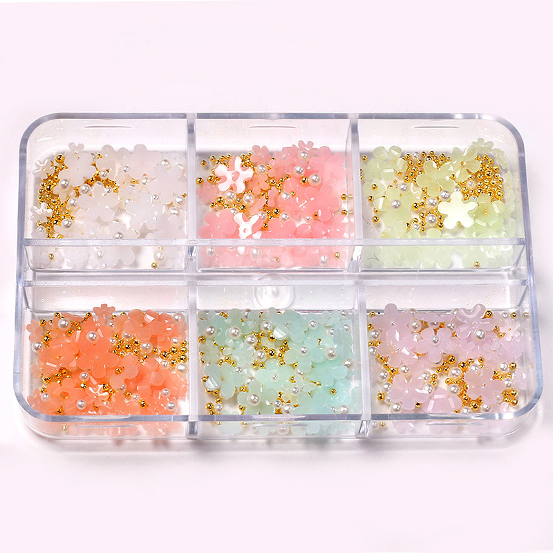 Manicura de estilo japonés joyería de flores de cinco pétalos joyería de flores pequeñas tridimensionales que cambian la luz Internet celebridad resina accesorios de uñas de flores de cinco pétalos