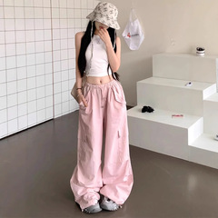 夏の薄いピンクのスーツのズボンの女性の速乾のスポーツのズボンの百合のゆったりしているワイドレギンスのデザイン感のモップのズボン
